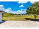 Large stone patio with a serene lake view at 9143 San Ambrosio, Orlando, FL 32836