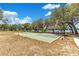 Basketball court, shaded seating area, and lake views offer many options for activities at 9143 San Ambrosio, Orlando, FL 32836