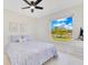 Bright bedroom with a ceiling fan and a scenic view of the lake at 9143 San Ambrosio, Orlando, FL 32836