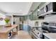 Bright kitchen features shaker cabinets, stainless appliances, and quartz counters at 9143 San Ambrosio, Orlando, FL 32836
