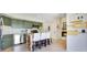 Bright kitchen showcasing green cabinets and a fireplace at 9143 San Ambrosio, Orlando, FL 32836