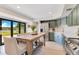 Bright kitchen with shaker cabinets, stainless appliances, and view to the lake at 9143 San Ambrosio, Orlando, FL 32836