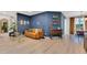 Open-concept living space featuring elegant decor, wood floors, and a seamless transition to the dining area at 9143 San Ambrosio, Orlando, FL 32836