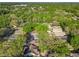 Aerial view of a suburban neighborhood with lush, mature trees at 998 Piedmont Oaks Dr, Apopka, FL 32703