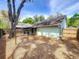 Spacious backyard featuring a screened-in porch and privacy fence at 998 Piedmont Oaks Dr, Apopka, FL 32703