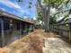 Large backyard with screen porch, privacy fence, and mature trees at 998 Piedmont Oaks Dr, Apopka, FL 32703