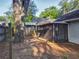 Spacious backyard featuring a screened-in porch and privacy fence at 998 Piedmont Oaks Dr, Apopka, FL 32703