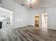 Bedroom with ceiling fan, wood-look tile, and easy access to closet and en suite bathroom at 998 Piedmont Oaks Dr, Apopka, FL 32703