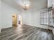 Bedroom featuring wood-look tile flooring, a ceiling fan, and window with blinds at 998 Piedmont Oaks Dr, Apopka, FL 32703