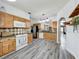 Spacious kitchen featuring wood cabinets, tile backsplash, and stainless appliances at 998 Piedmont Oaks Dr, Apopka, FL 32703