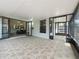 View of the screened lanai with tile flooring leading into the main house at 998 Piedmont Oaks Dr, Apopka, FL 32703