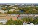 Aerial view of townhomes, community, and surrounding attractions in the distance at 10436 Ebb Tide Lane, Orlando, FL 32821