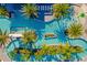 An aerial view shows a stunning resort pool with palm trees, lounge chairs, and various water features at 10436 Ebb Tide Lane, Orlando, FL 32821