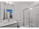 Modern bathroom with a shower and vanity at 10436 Ebb Tide Lane, Orlando, FL 32821