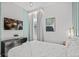 Bright bedroom with a queen-sized bed, TV, and modern decor at 10436 Ebb Tide Lane, Orlando, FL 32821