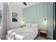 Bright and airy bedroom with a queen-sized bed and matching night stands at 10436 Ebb Tide Lane, Orlando, FL 32821