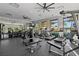 Well-equipped fitness center offering state-of-the-art exercise machines and ample natural light at 10436 Ebb Tide Lane, Orlando, FL 32821