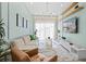 Spacious living room featuring neutral paint, modern lighting, and comfortable seating arrangement at 10436 Ebb Tide Lane, Orlando, FL 32821