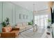 Bright living room with neutral walls, modern lighting, and comfortable seating arrangement at 10436 Ebb Tide Lane, Orlando, FL 32821