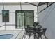 Patio area with table, chairs, and grill near the private pool at 10436 Ebb Tide Lane, Orlando, FL 32821