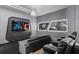 View of the custom home theater with recliner seating and Star Wars themed decor at 10436 Ebb Tide Lane, Orlando, FL 32821