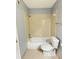 Cozy bathroom featuring a shower-tub combo and neutral tile flooring at 1055 S Hiawassee Rd # 2018, Orlando, FL 32835