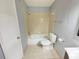 Cozy bathroom featuring a shower-tub combo and neutral tile flooring at 1055 S Hiawassee Rd # 2018, Orlando, FL 32835
