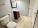 Bathroom featuring a vanity with a dark wood cabinet and tile flooring at 1055 S Hiawassee Rd # 2018, Orlando, FL 32835