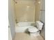 Cozy bathroom featuring a shower-tub combo and neutral tile flooring at 1055 S Hiawassee Rd # 2018, Orlando, FL 32835