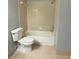 Cozy bathroom featuring a shower-tub combo and neutral tile flooring at 1055 S Hiawassee Rd # 2018, Orlando, FL 32835