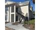 Exterior view of two story condo building with stairs leading up to the units at 1055 S Hiawassee Rd # 2018, Orlando, FL 32835