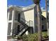 Two-story building with black staircases and palm trees at 1055 S Hiawassee Rd # 2018, Orlando, FL 32835