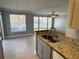 Kitchen with stainless steel sink, granite counters, and neutral cabinets at 1055 S Hiawassee Rd # 2018, Orlando, FL 32835