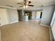 Open-concept kitchen and living room with tile floors and gray paint at 1055 S Hiawassee Rd # 2018, Orlando, FL 32835