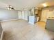 Spacious living room with tile flooring, neutral gray paint, and view of the kitchen area at 1055 S Hiawassee Rd # 2018, Orlando, FL 32835