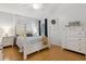 Well-lit bedroom boasts vaulted ceilings, neutral walls, and wood-look laminate floors at 1118 Brielle Ct, Oviedo, FL 32765