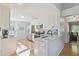 Bright kitchen features white cabinets, stainless appliances, and granite countertops at 1118 Brielle Ct, Oviedo, FL 32765
