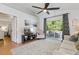 Spacious living room with vaulted ceiling, access to screened lanai, and comfortable seating at 1118 Brielle Ct, Oviedo, FL 32765