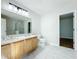 Modern bathroom features double vanity, marble countertops, and updated fixtures for a luxurious feel at 1176 Liberty Hall Dr, Kissimmee, FL 34746