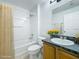 Cozy bathroom with a shower and bathtub, flowers, and a vanity with sink at 1176 Liberty Hall Dr, Kissimmee, FL 34746