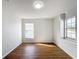 Bright bedroom offers wood floors and natural light from a window at 1176 Liberty Hall Dr, Kissimmee, FL 34746