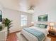 Cozy bedroom featuring a queen-size bed, soft lighting, a view, and stylish decor at 1176 Liberty Hall Dr, Kissimmee, FL 34746