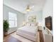 Bright bedroom with a white bed, soft rug, and modern furnishings for a cozy feel at 1176 Liberty Hall Dr, Kissimmee, FL 34746