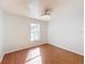 Bright bedroom features wood floors, neutral walls and ceiling fan lighting at 1176 Liberty Hall Dr, Kissimmee, FL 34746