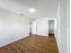 Spacious bedroom featuring wood-look floors and a walk-in closet, bathed in natural light at 1176 Liberty Hall Dr, Kissimmee, FL 34746