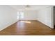 Neutral bedroom features natural light, wood floors, and white trim at 1176 Liberty Hall Dr, Kissimmee, FL 34746
