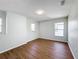 Light and airy bedroom with hardwood floors and natural light from dual windows at 1176 Liberty Hall Dr, Kissimmee, FL 34746