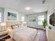 Well-lit bedroom with a plush bed, decor, and soft textures for a relaxing ambiance at 1176 Liberty Hall Dr, Kissimmee, FL 34746