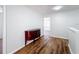 Hallway featuring wood floors, neutral walls, and a dark wood buffet with silver drawer pulls at 1176 Liberty Hall Dr, Kissimmee, FL 34746