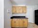 Kitchen with wooden cabinets, granite countertop, and pantry at 1176 Liberty Hall Dr, Kissimmee, FL 34746